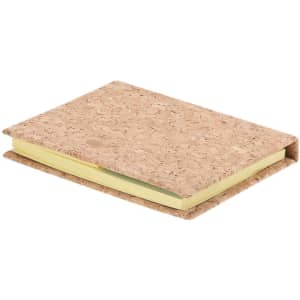 A cork notepad with a textured cover and yellow pages, featuring a logo on the front.