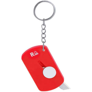 A red keyring featuring a small retractable cutter attached to a metal chain. It has a simple design with a circular button.