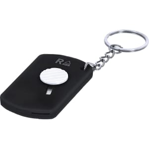 A black keyring cutter with a white circular button, attached to a metal keychain.