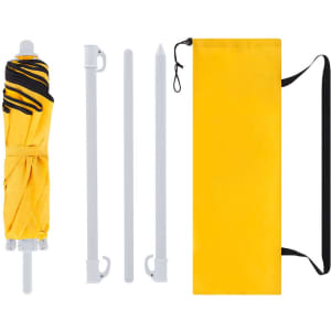 A yellow foldable beach umbrella, with white poles and a carrying bag, laid out in separate components.