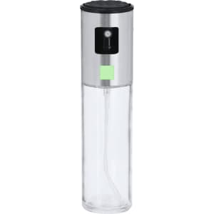 A transparent oil sprayer with a silver lid and a small green indicator, featuring a black top for easy grip.