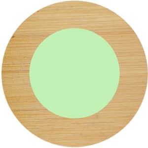 A round bamboo coaster featuring a light green circular centre. It has a smooth finish and a wooden texture.