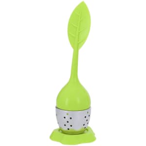 A tea infuser with a bright green leaf-shaped handle and a stainless steel body, placed on a matching base.