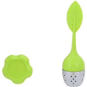 A tea infuser shaped like a leaf with a silver base and a matching green saucer.