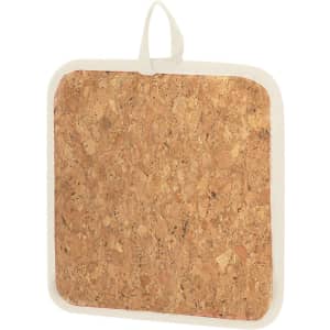 A square pot holder in natural cork with a cream fabric trim and a handy loop for hanging.