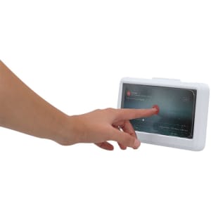 A white car phone holder with a hand interacting with a touchscreen display.