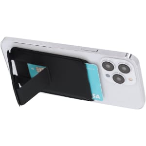 A black card holder stand attached to the back of a white smartphone, holding a credit card.