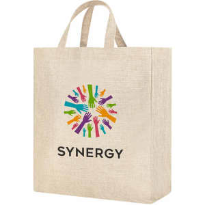 A tan tote bag featuring a colourful hand print design and a logo. The bag has two sturdy handles.