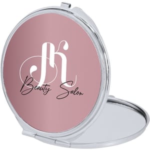 A compact pocket mirror in silver with a pink circular surface featuring a logo.