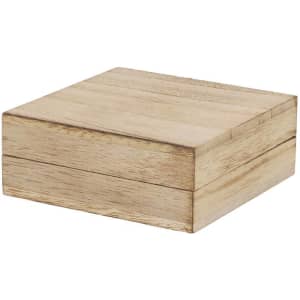 A wooden gift box with a light tan finish, featuring a simple, sleek design and a logo on the top.