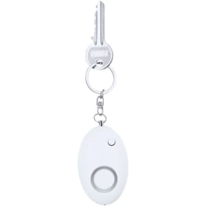 A white personal alarm attached to a keychain, featuring a circular button and a metal key.