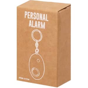 A brown cardboard box containing a personal alarm keychain, featuring a circular design and a keyring attachment.