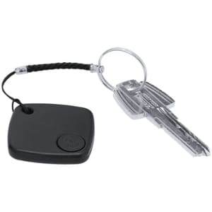 A black tracking device attached to a key ring with a silver key, featuring a textured surface and a braided cord.