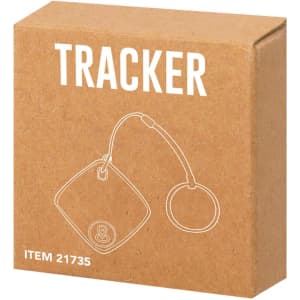 A brown cardboard box containing a tracking device with a circular attachment and a logo.