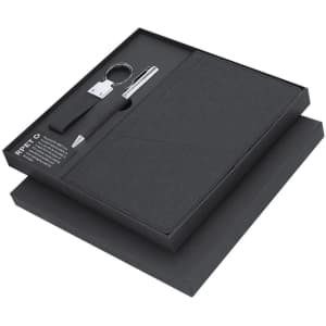 A black gift set featuring a notebook, pen, keyring, and packaging. Includes a branded logo.