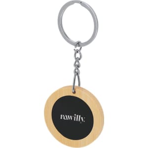 A circular bamboo keyring with a black accent and a metal keychain loop. It features a logo.