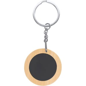 A round keyring featuring a bamboo design and a black circular section, attached to a metal ring.