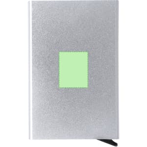 A silver business card holder with a green square and a black ribbon. It features a glossy, textured finish.