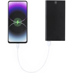 A black power bank connected to a smartphone via a charging cable. The background features a vibrant gradient.