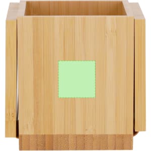 A bamboo pencil holder in a square design with a green square area. Features a logo on the side.