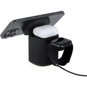 A wireless charger in black, designed to hold a smartphone, earbuds, and a smartwatch simultaneously. Features a logo.
