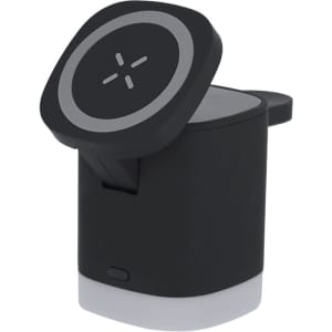 A wireless charger in black with a circular top and a small light on the base. Features a logo.