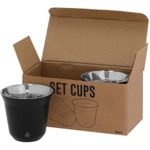 A set of two cups, one black and one silver, displayed in a cardboard box. The cups have a sleek design and a branding logo.