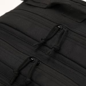 A black backpack featuring multiple zippered compartments and a textured fabric design, with branding.