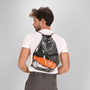 A transparent black drawstring bag worn on a person’s back, containing an orange drink bottle and a fan.