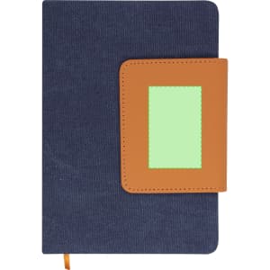 A navy notepad with a brown leatherette cover and a rectangular green patch, featuring a logo on the front.
