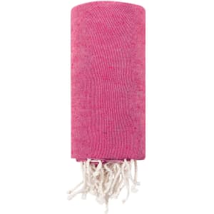 A pink towel pareo with white tassels, featuring a logo. Ideal for leisure and outdoor activities.