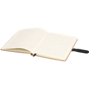 A notepad with lined pages and a black ribbon bookmark, featuring a soft cover in a neutral colour.