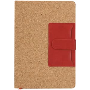 A cork-covered notepad with a red leather strap closure and a pocket on the front. It has a simple and natural design.