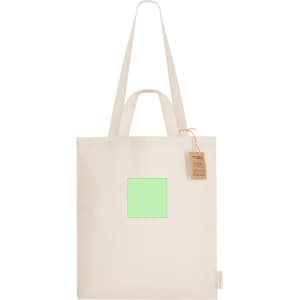 A cream tote bag with long handles, featuring a blank square area and a tag attached.