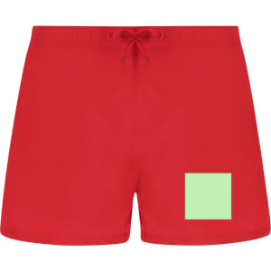 Red swimming trunks featuring a square green patch, with a drawstring waist and a logo on the side.