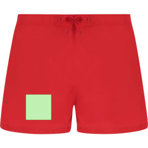 Red swimming trunks featuring a green square patch and a drawstring waist. The design includes a logo.