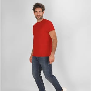 A red adult T-shirt displayed on a model wearing jeans, with the shirt's brand logo visible.
