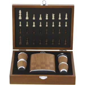 A drink flask set featuring a wooden flask, two cups, and a collection of chess pieces inside a wooden box.