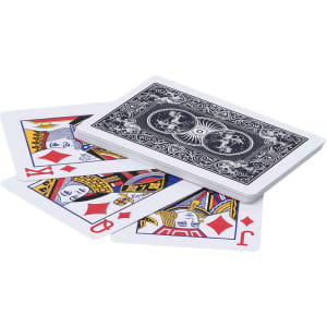 A deck of playing cards in a variety of designs and colours, with a black-backed card prominently displayed on top.