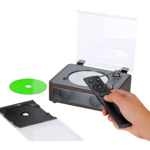 A CD player with a transparent lid, a remote control, and a green CD next to it. It features a logo on the front.