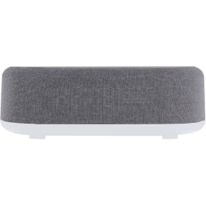 A grey multifunction alarm clock with a fabric texture and a white base, featuring a branding logo.