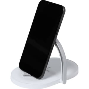 A wireless charger in white with a silver stand, featuring a smartphone resting on it.