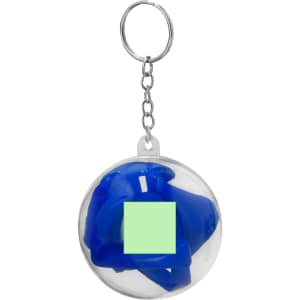 A keychain featuring a clear round casing with a blue cup cover inside. The design includes a keyring attachment.