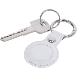 A white keychain featuring a circular tracker and a metal key attached to a silver ring.
