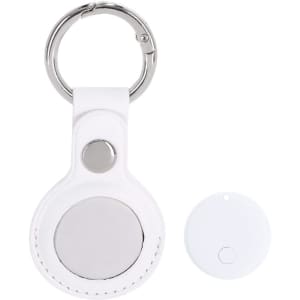 A white keychain accessory with a circular tracker and a detachable round tracker disc. Features a silver snap button.