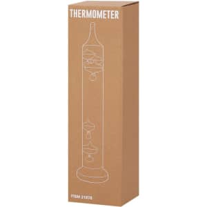 A Galileo thermometer in a tall, clear design, packaged in a simple cardboard box.