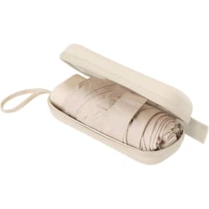 A foldable umbrella in a beige carrying case, securely rolled and wrapped for storage.