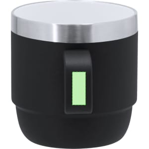 A black coffee mug with a stainless steel rim and a green accent on the handle. It features a branding logo.