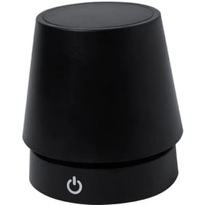 A black lamp with a rounded top and a base featuring a power button. It has a smooth finish and modern design.