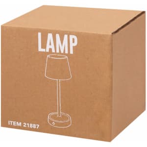 A brown cardboard box containing a lamp design illustration. The box features a simple, modern lamp silhouette.